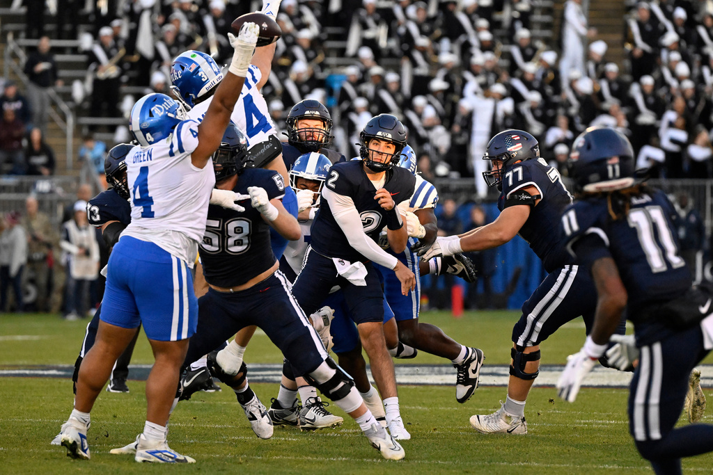 UConn quarterback Joe Fagnano (2) has a pass blocked by Duke defensive tackle Josiah Green (4) during the first half of an NCAA college football game, Saturday, Nov. 8, 2025, in East Hartford, Conn. (AP Photo/Jessica Hill)
