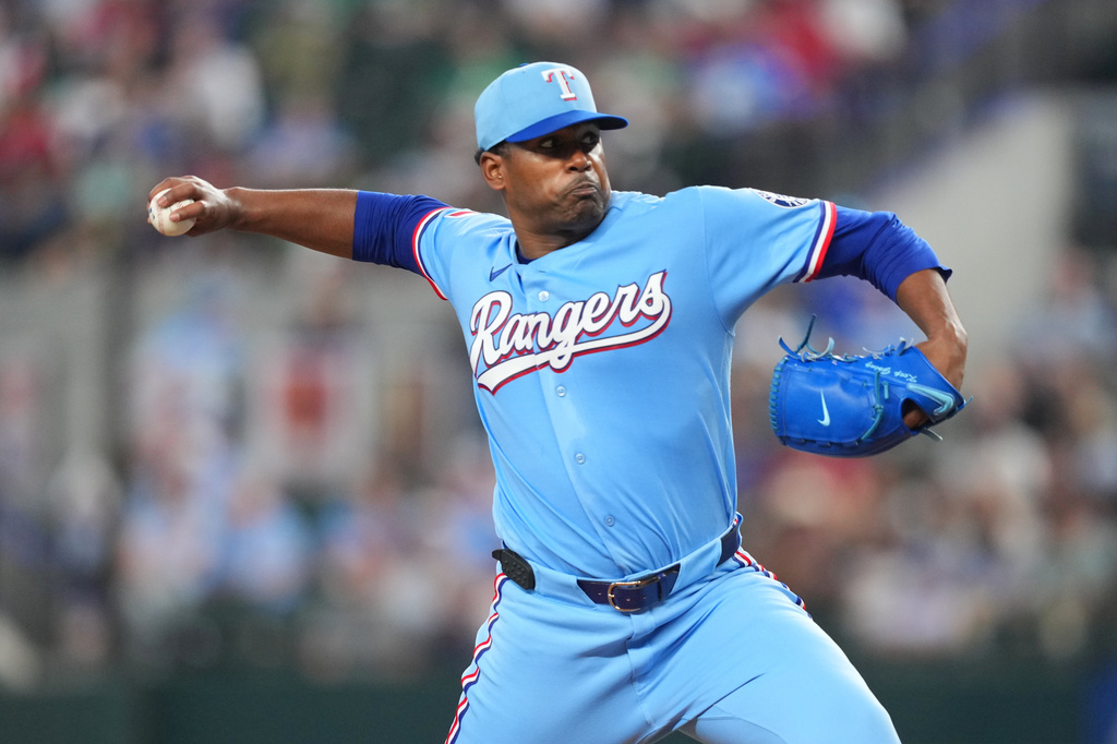 Texas Rangers starting pitcher Kumar Rocker throws to the Athletics during the fourth inning of a baseball game Sunday, April 26, 2026, in Arlington, Texas. (AP Photo/Julio Cortez)