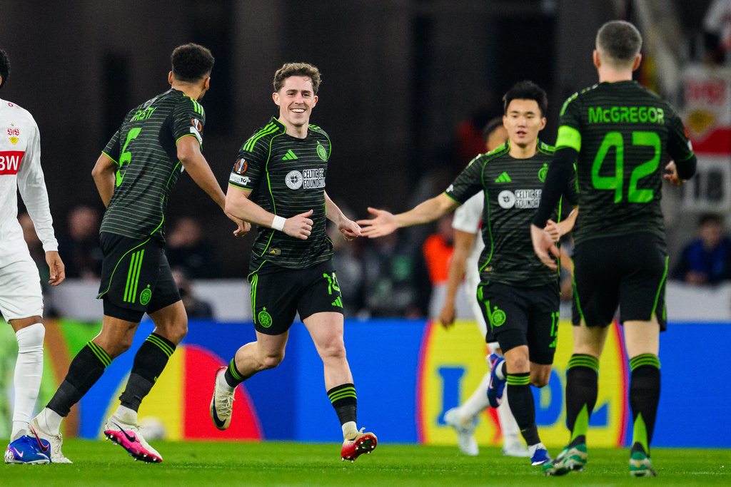 Celtic's Luke McCowan, 2nd left, celebrates scoring their side's first goal of the game during a Europa League soccer match between VfB Stuttgart and Celtic Glasgow in Stuttgart, Germany, Thursday, Feb. 26, 2026. (Tom Weller/dpa via AP)