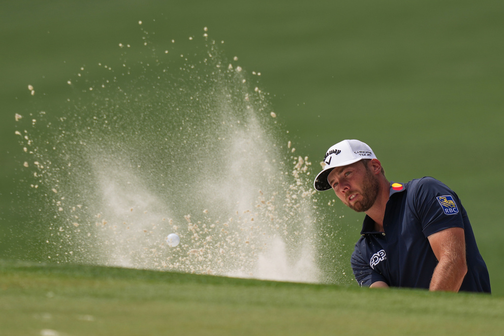 Sam Burns hits from the bunker on the sixth hole during a practice round ahead of the Masters golf tournament at the Augusta National Golf Club, Tuesday, April 7, 2026, in Augusta, Ga. (AP Photo/Matt Slocum)