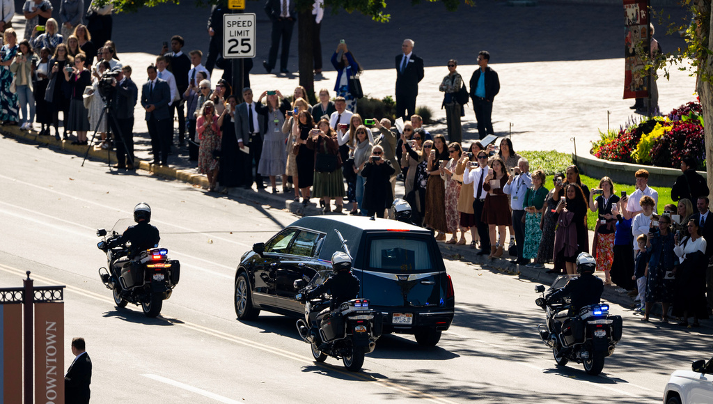 People line the street as the procession begins following the funeral services at the Conference Center for President Russell M. Nelson, the 17th president of The Church of Jesus Christ of Latter-day Saints, in Salt Lake City on Oct. 7, 2025. (Scott G Winterton/The Deseret News via AP)