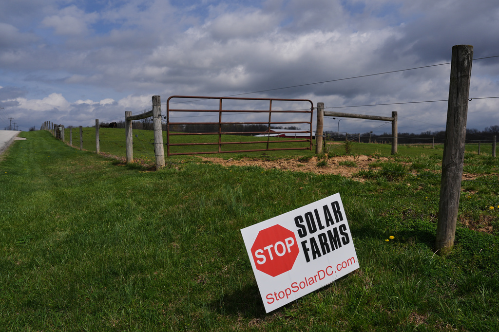A sign opposing a nearby solar development sits near a pasture Friday, April 3, 2026, in Manchester, Ind. (AP Photo/Joshua A. Bickel)
