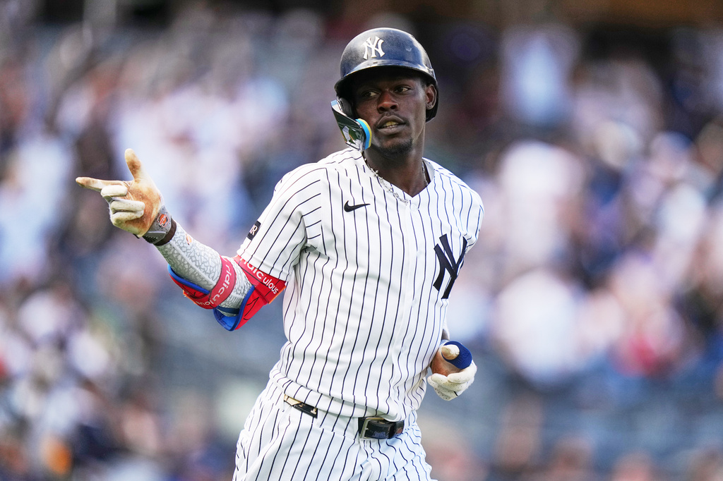 New York Yankees' Jazz Chisholm Jr. gestures to teammates after hitting a two-run home run during the seventh inning of a baseball game against the Toronto Blue Jays Sunday, Aug. 23, 2026, in New York. (AP Photo/Frank Franklin II)