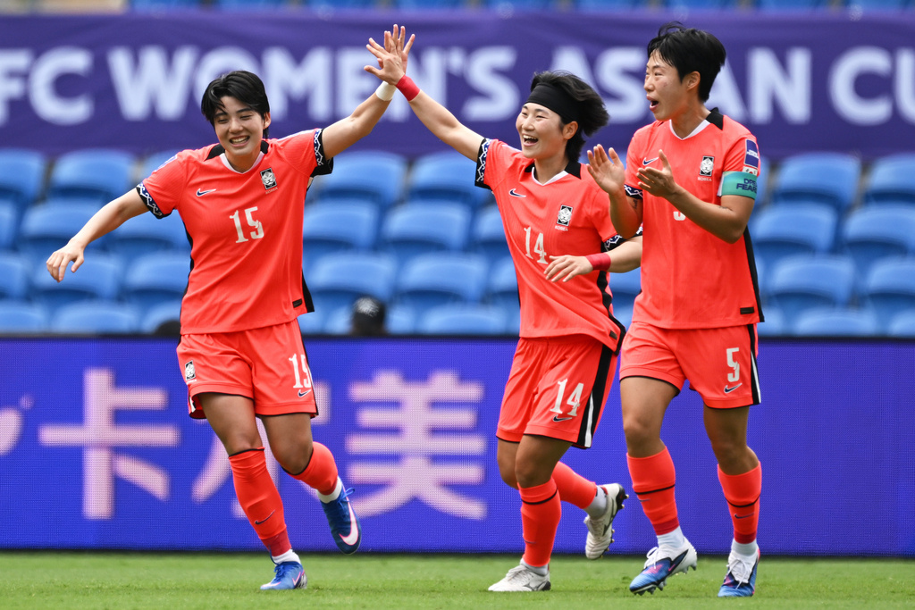 South Korea's Jeon Yu-gyeong, left, is congratulated by teammates after scoring her team's first goal during the Women's Asia Cup soccer match between South Korea and the Philippines in Robina, Australia, Thursday, March 5, 2026. (Dave Hunt/AAPImage via AP)