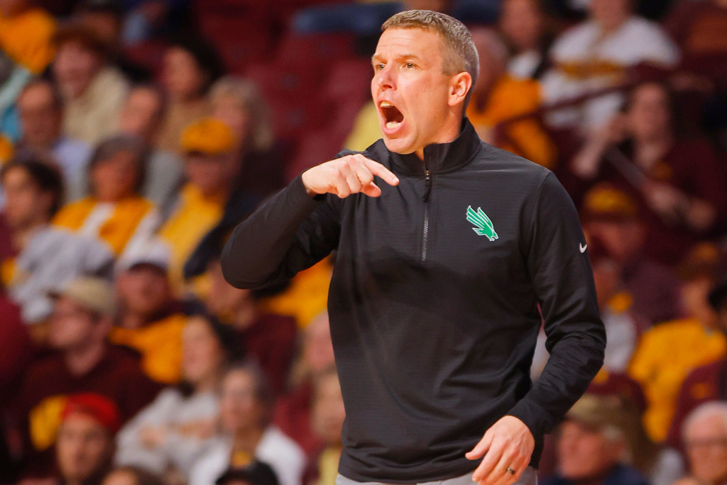 FILE - North Texas head coach Ross Hodge instructs his team as they play Minnesota in the second half of an NCAA college basketball game Wednesday, Nov. 13, 2024, in Minneapolis. (AP Photo/Bruce Kluckhohn, File)