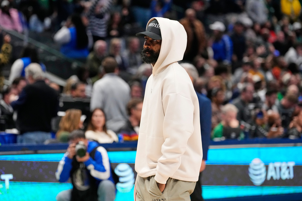 Dallas Mavericks guard Kyrie Irving stands on the court during a time ou in the second half of an NBA basketball game againt the Minnesota Timberwolves Wednesday, Jan. 28, 2026, in Dallas. (AP Photo/Tony Gutierrez)