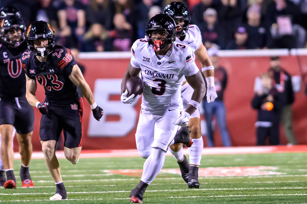 Cincinnati running back Tawee Walker (3) runs in open space for a first down during the first half an NCAA college football game against Utah, Saturday, Nov. 1, 2025, in Salt Lake City, Utah. (AP Photo/Tyler Tate)