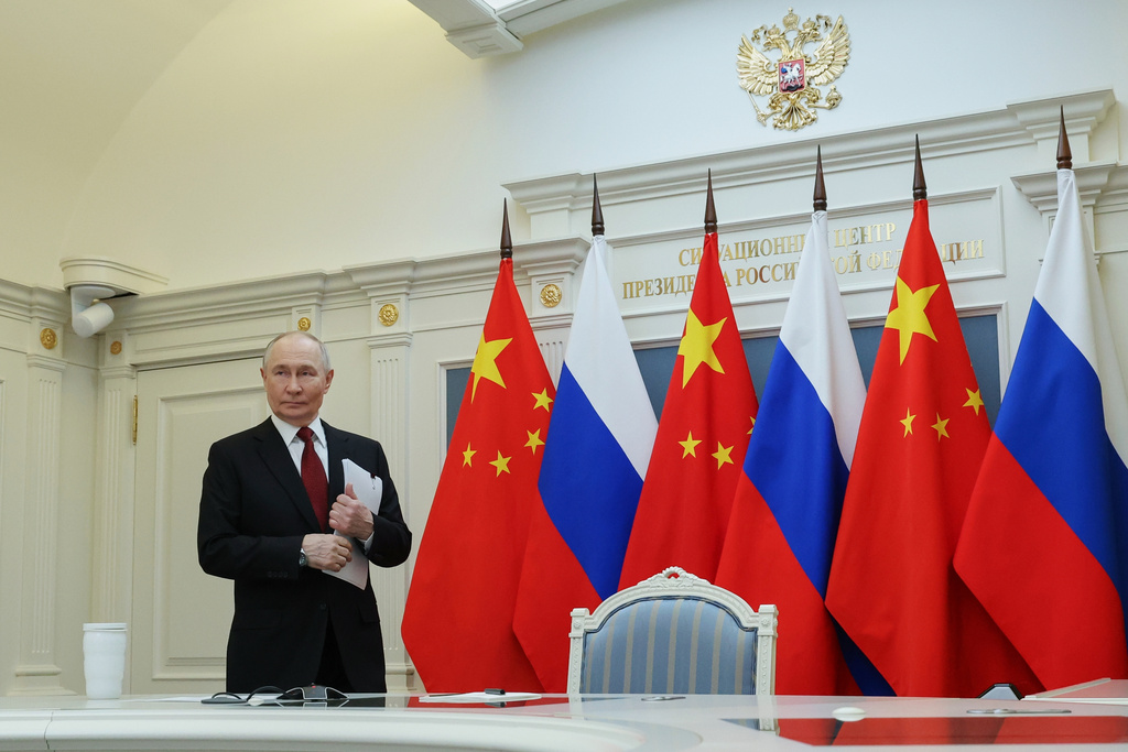 Russian President Vladimir Putin arrives to attend videoconference with Chinese President Xi Jinping at the Kremlin in Moscow, Wednesday, Feb. 4, 2026. (Vyacheslav Prokofyev/Sputnik, Kremlin Pool Photo via AP)