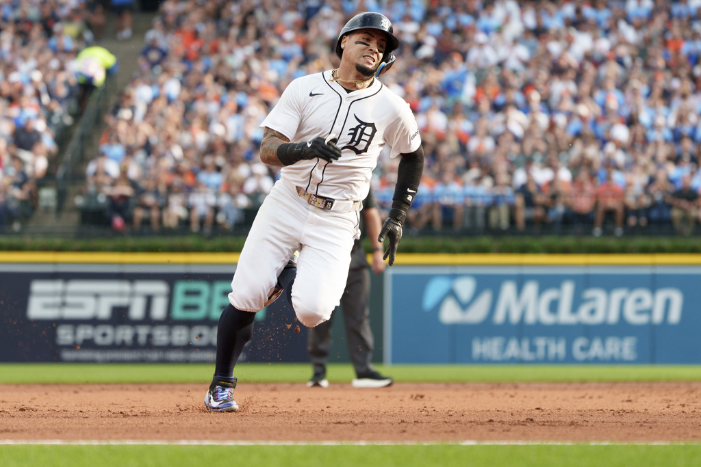 Detroit Tigers' Javier Báez runs to third base during the third inning of a baseball game Kansas City Royals Saturday, Aug. 23, 2025, in Detroit. (AP Photo/Josh Boland )