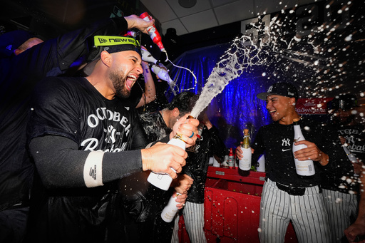 TheNew York Yankees celebrate in the locker room after defeating the Boston Red Sox in Game 3 of an American League wild-card baseball playoff series, Thursday, Oct. 2, 2025, in New York. (AP Photo/Yuki Iwamura) TheNew York Yankees celebrate in the locker room after defeating the Boston Red Sox in Game 3 of an American League wild-card baseball playoff series, Thursday, Oct. 2, 2025, in New York. (AP Photo/Yuki Iwamura)