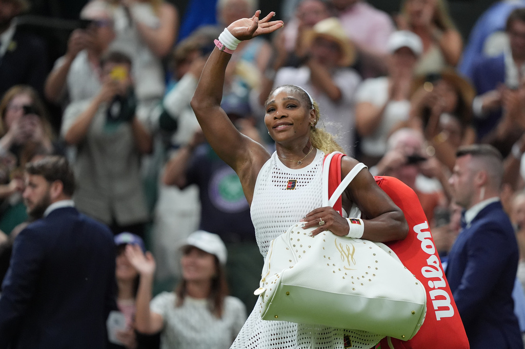 Serena Williams of the United States greets the audience as she leaves after losing to Maya Joint of Australia in their first round women's singles match at the Wimbledon Tennis Championships in London, Tuesday, June 30, 2026. (AP Photo/Maja Smiejkowska)