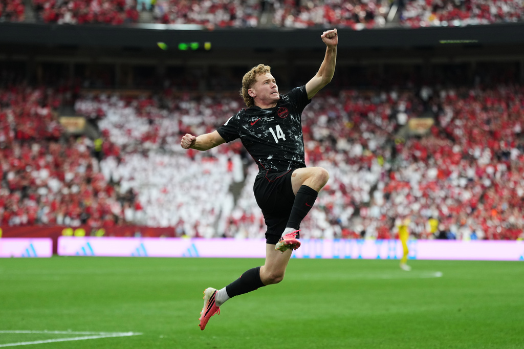Canada's Jacob Shaffelburg celebrates after Qatar's Mohamed Manai scores an own goal during the World Cup Group B soccer match in Vancouver, British Columbia, Thursday, June 18, 2026. (AP Photo/Abbie Parr)