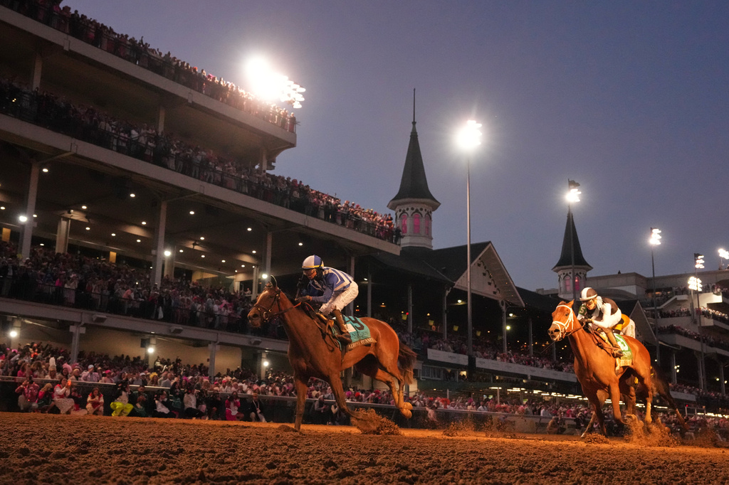 Always a Runner, left, ridden by Jose L. Ortiz wins the 152nd running of the Kentucky Oaks horse race at Churchill Downs, Friday, May 1, 2026, in Louisville, Ky. (AP Photo/Abbie Parr)
