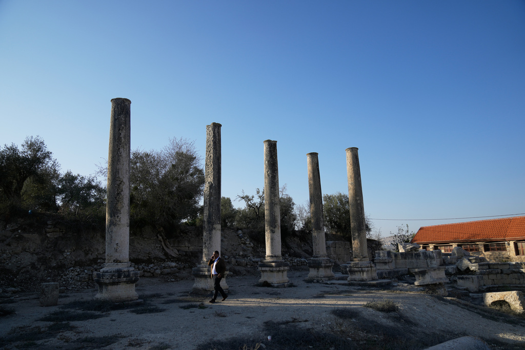 Palestinian Muhammad Azem, the mayor of Sebastia, inspects the Roman historical site in the West Bank town of Sebastia Thursday, Nov. 20, 2025. (AP Photo/Nasser Nasser)