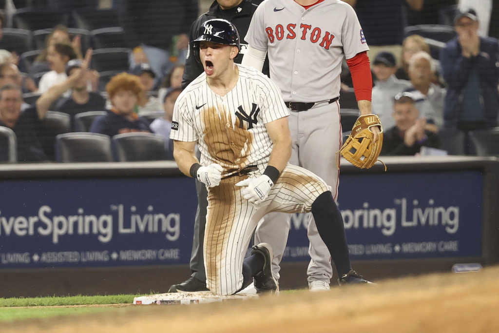 New York Yankees' Ben Rice reacts after hitting a triple during the seventh inning of a baseball game against the Boston Red Sox, Thursday, Aug. 21, 2025, in New York. (AP Photo/Pamela Smith)