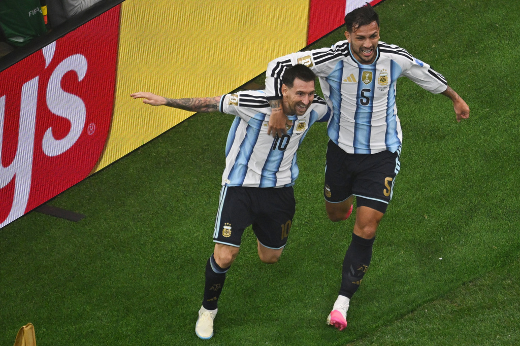 Argentina's Lionel Messi, left, is congratulated by Leandro Paredes after scored during the World Cup Group J soccer match between Argentina and Austria in Arlington, Texas, near Dallas, Monday, June 22, 2026. (AP Photo/Jessica Tobias)