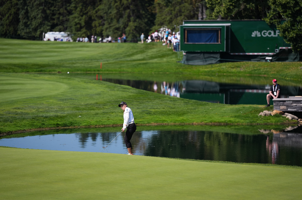 Canada's Brooke Henderson hits her third shot on the ninth hole during the second round at the LPGA Canadian Women's Open golf tournament in Edmonton, Alberta, Friday, Aug. 21, 2026. (Darryl Dyck/The Canadian Press via AP)