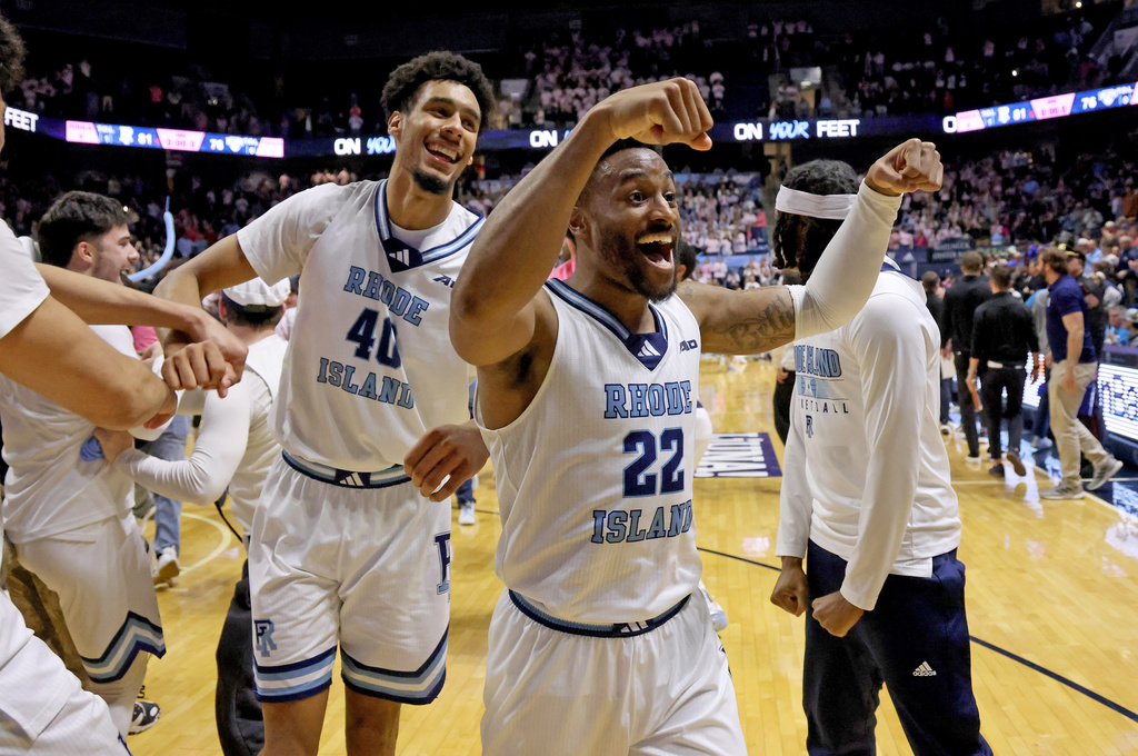 Rhode Island guard RJ Johnson (22) and forward Keeyan Itejere (40) celebrate their win over Saint Louis in an NCAA college basketball game, Tuesday, Feb. 17, 2026, in South Kingstown, R.I. (AP Photo/Mark Stockwell)