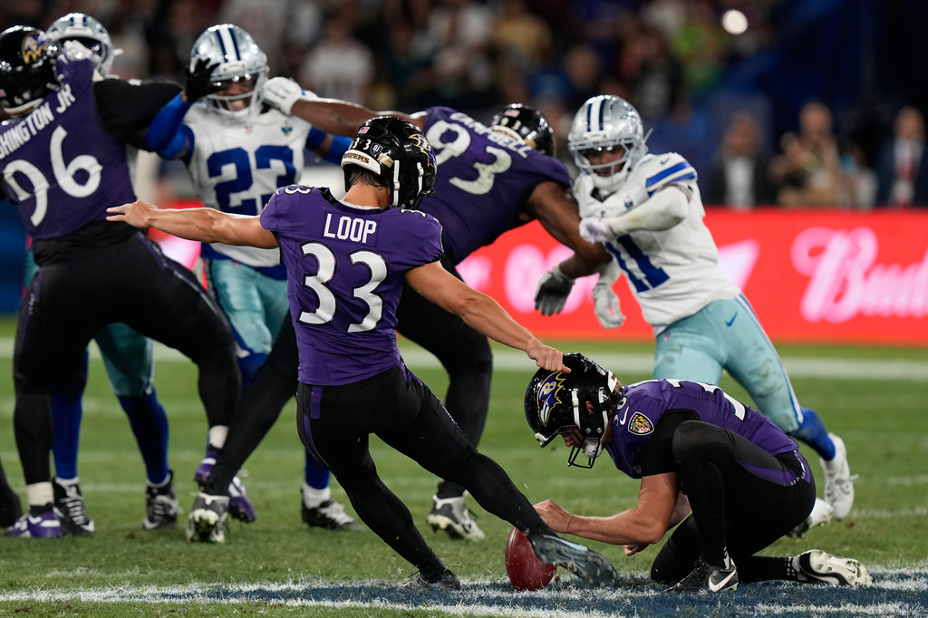 Baltimore Ravens place kicker Tyler Loop (33) kicks the game-winning field goal during the second half of an NFL football game against the Dallas Cowboys in Rio de Janeiro, Sunday, Sept. 27, 2026. (AP Photo/Fernando Llano)