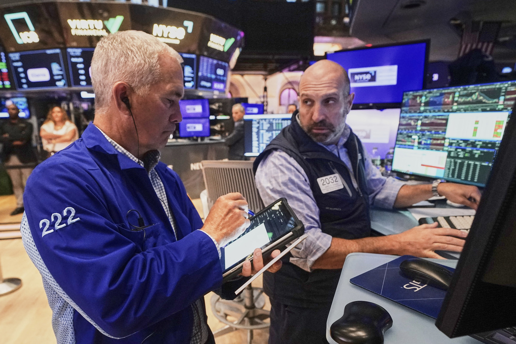 Trader Timothy Nick, left, and specialist James Denaro work on the floor of the New York Stock Exchange, Wednesday, Sept. 10, 2025. (AP Photo/Richard Drew)