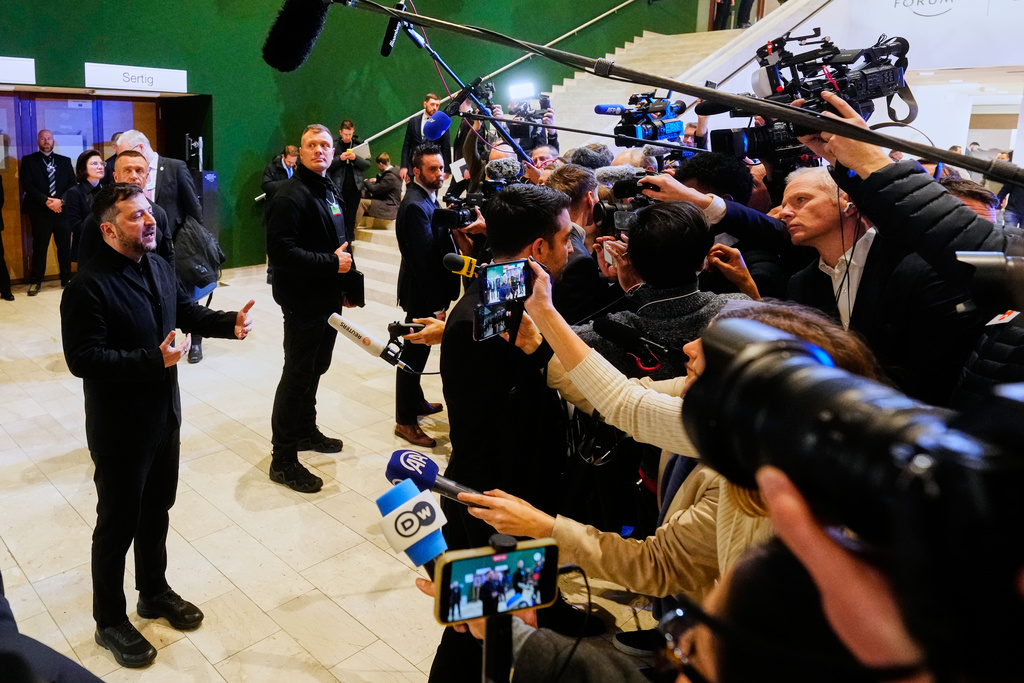 Ukraine's President Volodymyr Zelenskyy talks to the media at the Annual Meeting of the World Economic Forum in Davos, Switzerland, Thursday, Jan. 22, 2026. (AP Photo/Markus Schreiber)