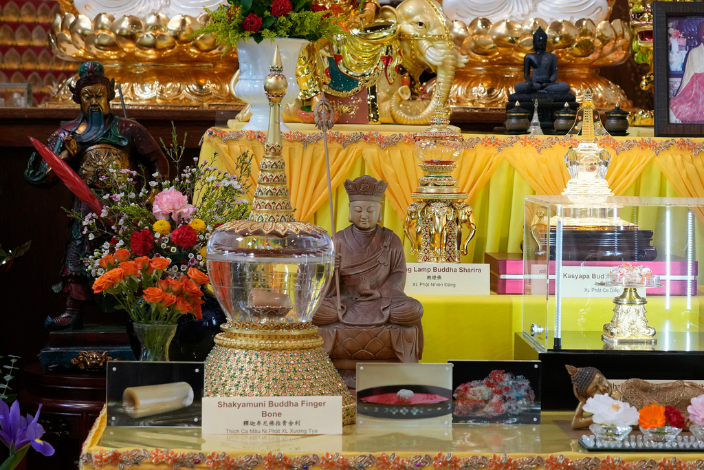Buddhist relics, including the Shakyamuni Buddha Finger Bone, left, are displayed at Wei Mountain Temple, in Rosemead, Calif., Saturday, Feb. 17, 2024. (AP Photo/Damian Dovarganes)