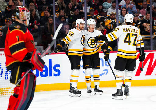 Boston Bruins Morgan Geekie, middle right, celebrates his first period goal with teammates Sean Kuraly (52) and Mark Kastelic (47) on Ottawa Senators goaltender Leevi Meriläinen (1) during the first period of an NHL hockey game in Ottawa on Monday, Oct. 27, 2025. (Sean Kilpatrick/The Canadian Press via AP) Boston Bruins Morgan Geekie, middle right, celebrates his first period goal with teammates Sean Kuraly (52) and Mark Kastelic (47) on Ottawa Senators goaltender Leevi Meriläinen (1) during the first period of an NHL hockey game in Ottawa on Monday, Oct. 27, 2025. (Sean Kilpatrick/The Canadian Press via AP)