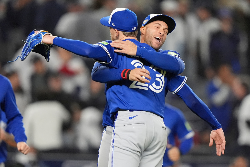 The Toronto Blue Jays celebrate after defeating the New York Yankees in Game 4 of baseball's American League Division Series, Wednesday, Oct. 8, 2025, in New York. (AP Photo/Frank Franklin II)