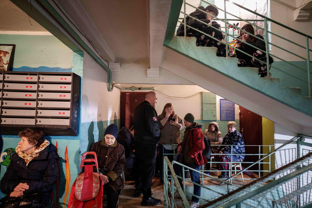 People take shelter inside a house damaged after a Russian strike on residential area in Kyiv, Ukraine, on Thursday, April 16, 2026. (AP Photo/Evgeniy Maloletka)