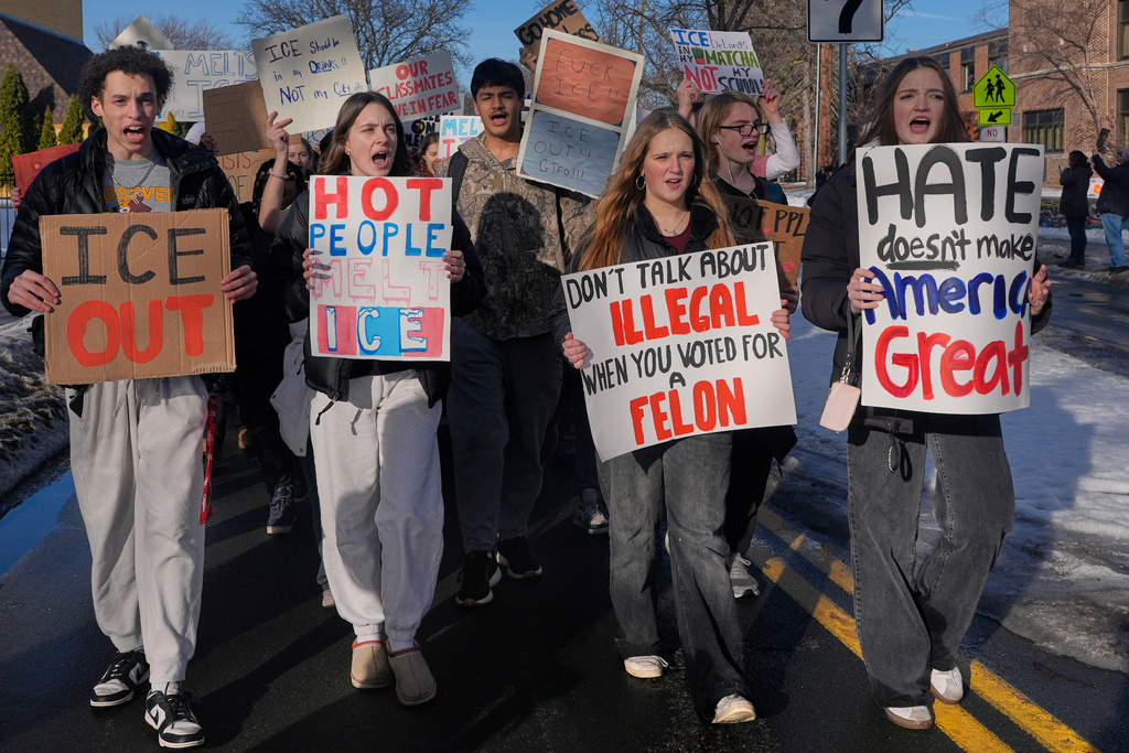 EDS NOTE: OBSCENITY - Students walk out of Roosevelt High School during a protest, Monday, Jan. 12, 2026, in Minneapolis. (AP Photo/Jen Golbeck)