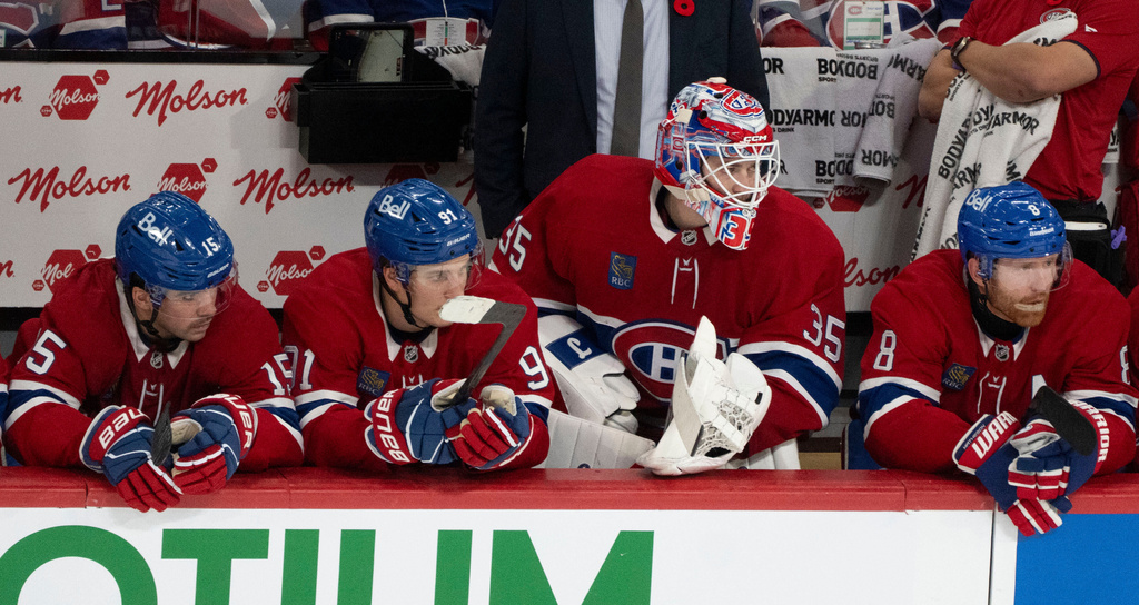 Montreal Canadiens goaltender Sam Montembeault watches action from the bench during the third period of an NHL hockey game in Montreal, Tuesday, Nov. 11, 2025. (Christinne Muschi/The Canadian Press via AP)