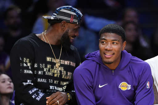 Los Angeles Lakers' Lebron James, left, and Rui Hachimura share a light moment on the bench during the first half of a preseason NBA basketball game against the Sacramento Kings Friday, Oct. 17, 2025, in Los Angeles. (AP Photo/Jae C. Hong) Los Angeles Lakers' Lebron James, left, and Rui Hachimura share a light moment on the bench during the first half of a preseason NBA basketball game against the Sacramento Kings Friday, Oct. 17, 2025, in Los Angeles. (AP Photo/Jae C. Hong)
