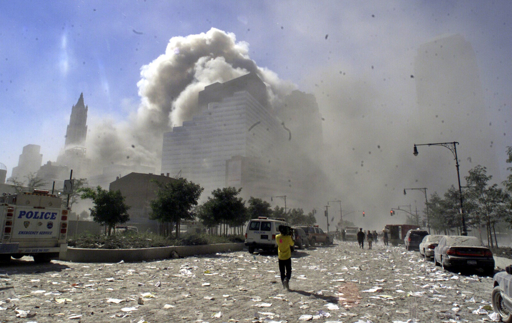 FILE - A street in New York's lower Manhattan area is littered with debris after the collapse of the twin towers of the World Trade Center following terrorist attacks, Sept. 11, 2001. (AP Photo/Richard Drew File,)