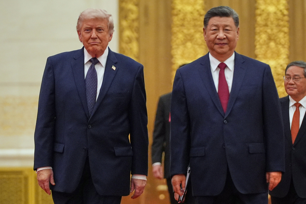 FILE - President Donald Trump, left, and Chinese President Xi Jinping arrive a state dinner at the Great Hall of the People May 14, 2026, in Beijing. (AP Photo/Mark Schiefelbein)