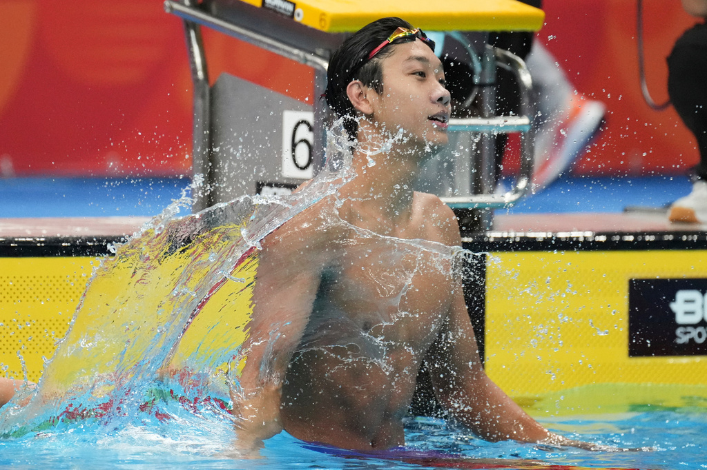 Zhang Zhanshuo of China reacts after winning the men's 400m freestyle swimming final at the Asian Games in Tokyo, Japan, Friday, Sept. 25, 2026. (AP Photo/Hiro Komae)