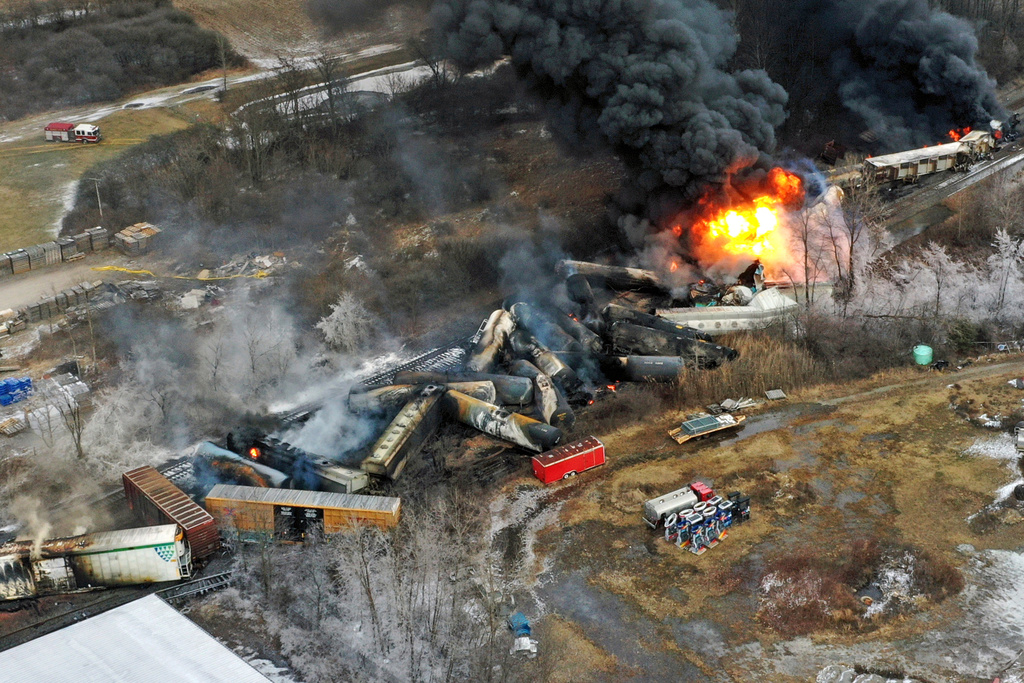 FILE - In this photo taken with a drone, portions of a Norfolk Southern freight train that derailed in East Palestine, Ohio, remain on fire, Feb. 4, 2023. (AP Photo/Gene J. Puskar, File)