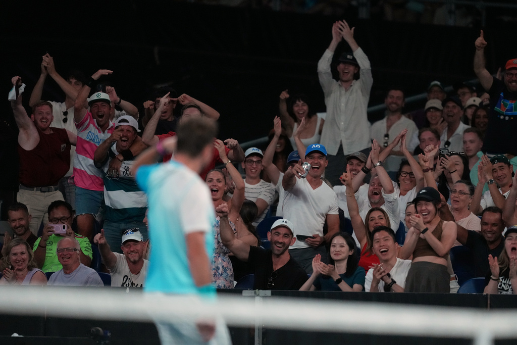 Spectators cheer Stan Wawrinka of Switzerland during his third round match against Taylor Fritz of the U.S. at the Australian Open tennis championship in Melbourne, Australia, Saturday, Jan. 24, 2026. (AP Photo/Asanka Brendon Ratnayake)