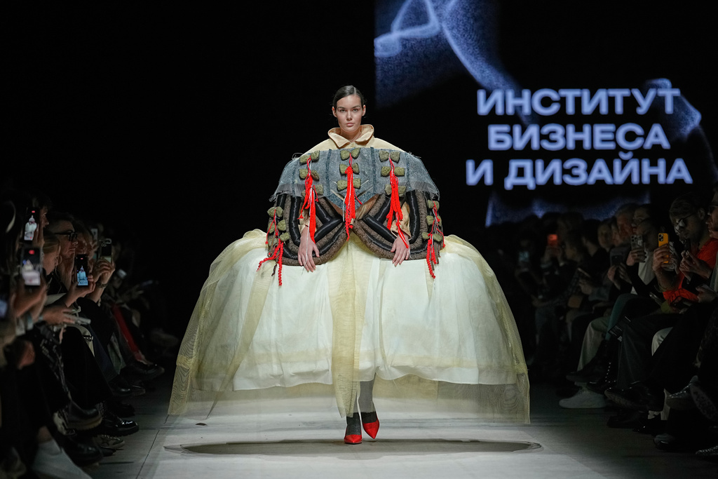 A model wears a creation by students of the Russian Institute of Business and Design B&D on a runway at the Moscow Fashion Week in Moscow, Thursday, March 19, 2026. (AP Photo/Alexander Zemlianichenko)