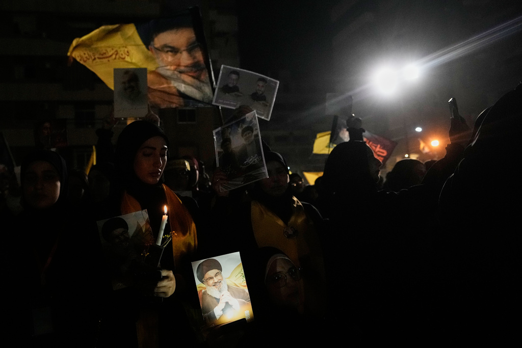 People gather at the site where Hezbollah leader Hassan Nasrallah was killed in Israeli airstrikes on Sept. 27, 2024, a day before the first anniversary of his death, in the Haret Hreik suburb south of Beirut, Lebanon, Friday, April 26, 2025. (AP Photo/Hassan Ammar)