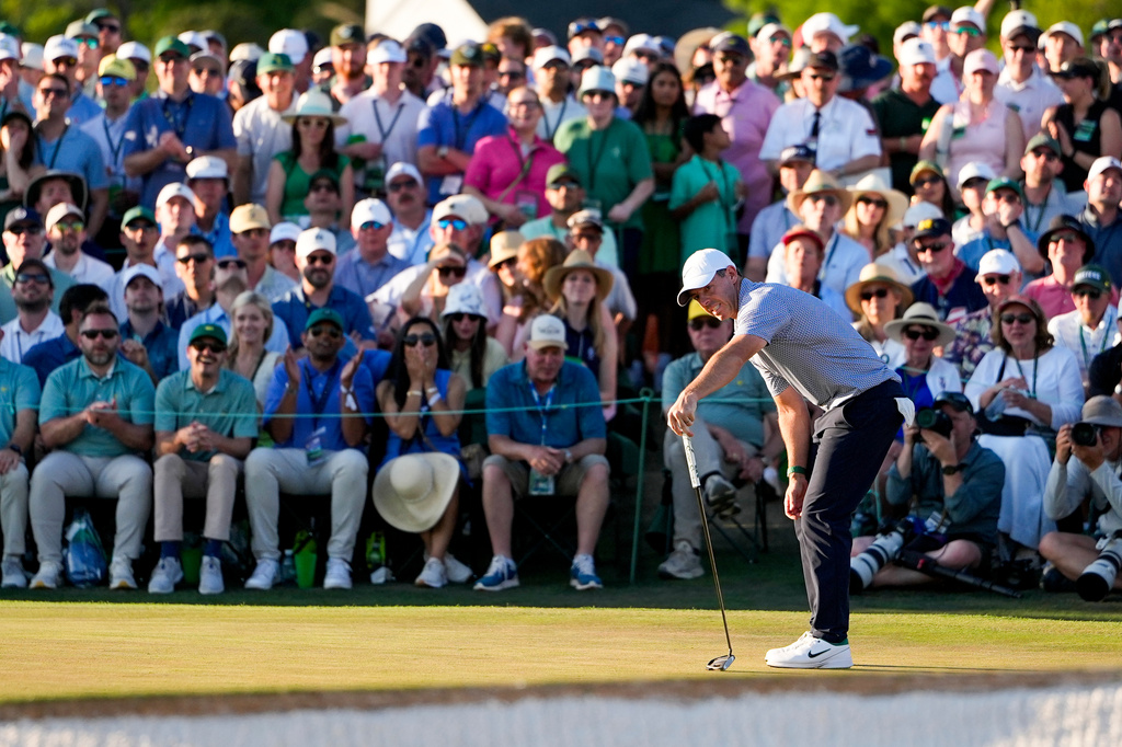 Rory McIlroy, of Northern Ireland, reacts after missing a putt on the 18th hole during the third round of the Masters golf tournament at the Augusta National Golf Club, Saturday, April 11, 2026, in Augusta, Ga. (AP Photo/Ashley Landis)