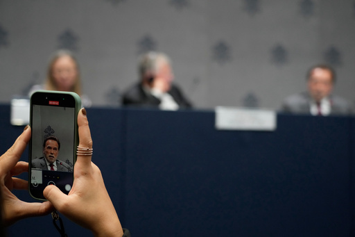 A journalist scans with his phone former California Gov. Arnold Schwarzenegger during a press conference at the Vatican, Tuesday, Sept. 30, 2025, to present the "Raising Hope for Climate Justice Conference," promoted by the Laudato Si' (Praise Be to You) Movement, which was inspired by the late Pope Francis' encyclical letter of the same name. (AP Photo/Gregorio Borgia) A journalist scans with his phone former California Gov. Arnold Schwarzenegger during a press conference at the Vatican, Tuesday, Sept. 30, 2025, to present the "Raising Hope for Climate Justice Conference," promoted by the Laudato Si' (Praise Be to You) Movement, which was inspired by the late Pope Francis' encyclical letter of the same name. (AP Photo/Gregorio Borgia)
