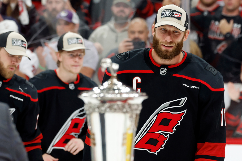 Carolina Hurricanes' Jordan Staal (11) skates to accept the Prince of Wales Trophy following Game 5 of the Eastern Conference finals NHL hockey Stanley Cup playoff series against the Montreal Canadiens in Raleigh, N.C., Friday, May 29, 2026. (AP Photo/Karl DeBlaker)