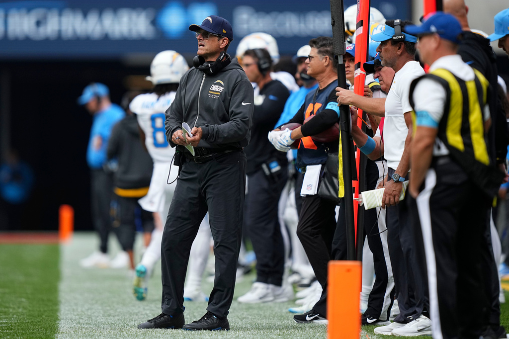 Los Angeles Chargers head coach Jim Harbaugh watches from the sideline during the first half of an NFL football game against the Buffalo Bills, Sunday, Sept. 27, 2026, in Orchard Park, N.Y. (AP Photo/Matt Rourke)