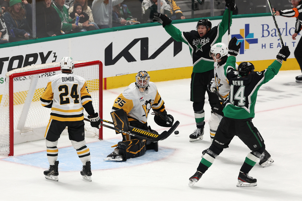 Pittsburgh Penguins goaltender Tristan Jarry (35) looks back after allowing a goal to Dallas Stars defenseman Miro Heiskanen (not shown) during the third period of an NHL hockey game Sunday, Dec. 7, 2025, in Dallas. (AP Photo/Sam Hodde)