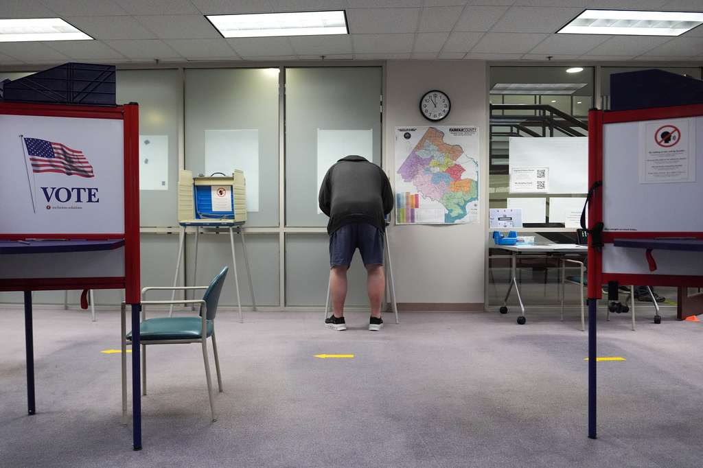 A person early votes in the Virginia redistricting referendum at the Fairfax County Government Center, Friday, April 3, 2026, in Fairfax, Va. (AP Photo/Julia Demaree Nikhinson)