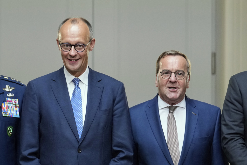 German Chancellor Friedrich Merz, left, and German Defense Minister Boris Pistorius pose for a group picture prior to the Cabinet meeting at the Defense Ministry in Berlin, Germany, Wednesday, Aug. 27, 2025. (AP Photo/Ebrahim Noroozi)