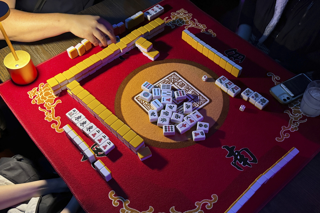 People play mahjong at an event organized by the YLL Mahjong Club on Friday, Aug. 15, 2025, in San Francisco. (AP Photo/Terry Chea)
