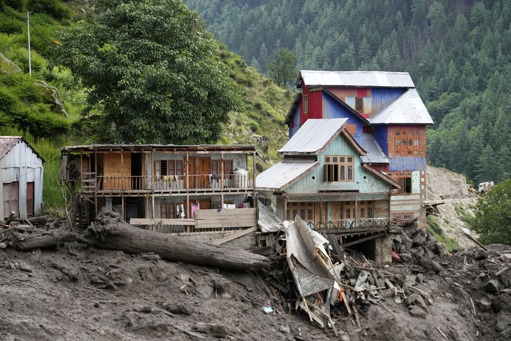 Buildings damaged by Thursday's flash floods are seen in Chositi village, Kishtwar district, Indian-controlled Kashmir, Friday, Aug. 15, 2025. (AP Photo/Channi Anand)