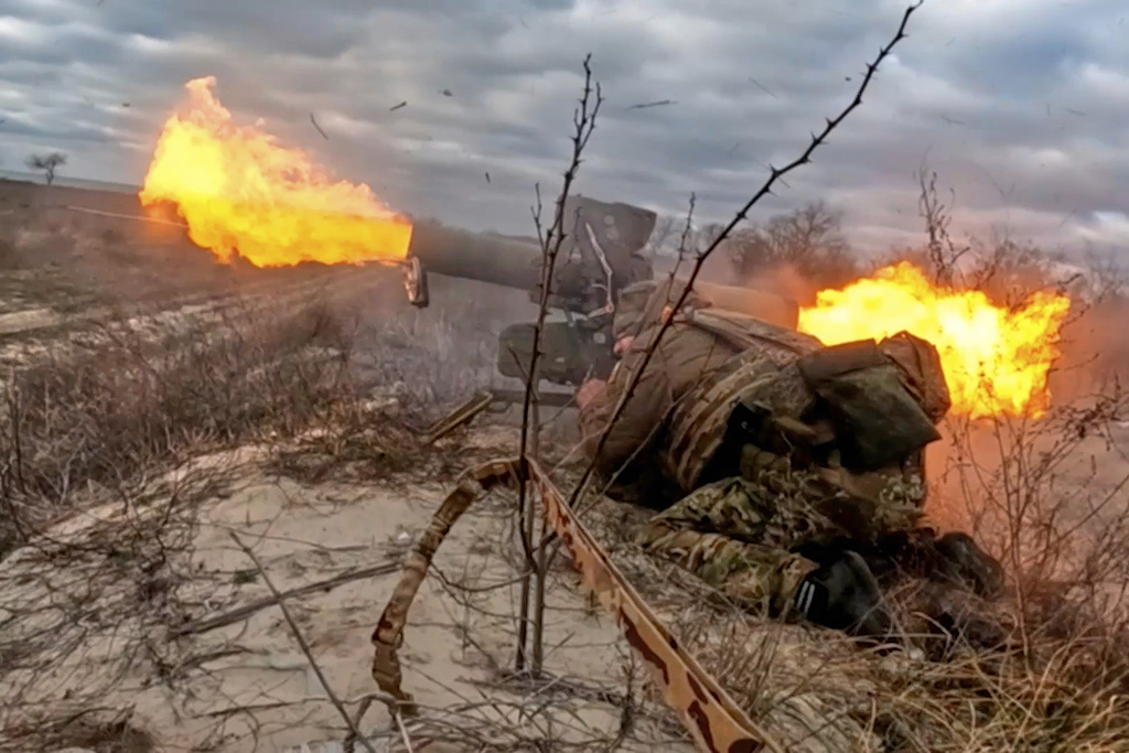 In this image made from video provided by Russian Defense Ministry Press Service on Friday, Nov. 7, 2025, a Russian army soldier fires a Fagot anti-tank missile system towards an Ukrainian position at an undisclosed location. (Russian Defense Ministry Press Service via AP)