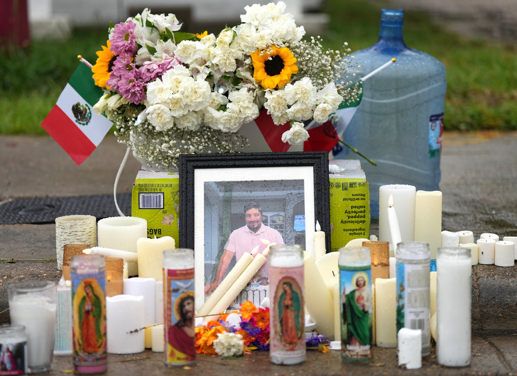A memorial grows at the site where Lorenzo Salgado Araujo was fatally shot by ICE agents, last week, on Monday, July 13, 2026, in Houston. (AP Photo/Karen Warren)